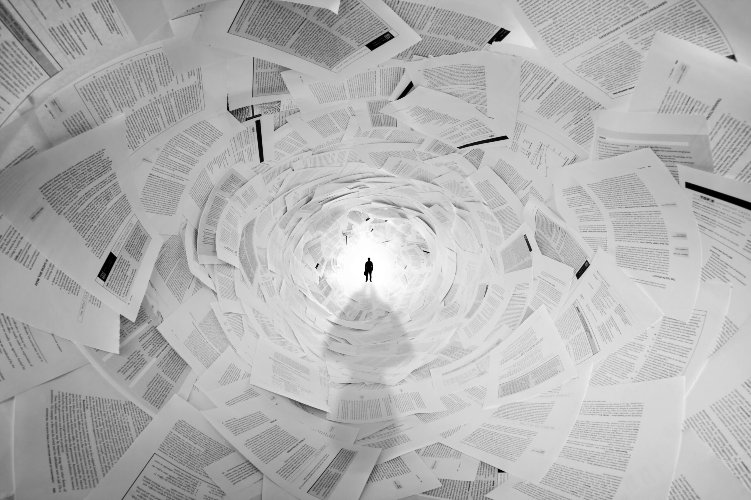 Silhouette of businessman in the end of documents tunnel